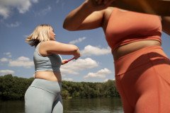 side-view-women-exercising-together