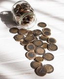 high-view-jar-full-euro-coins_23-2148546872