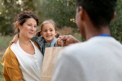 close-up-people-with-food-donations_23-2149182028