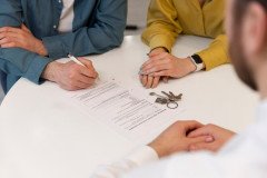 male-real-estate-agent-doing-business-showing-house-potential-buying-couple_23-2150164686