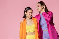 medium-shot-smiley-women-pop-party-studio_23-2149403605